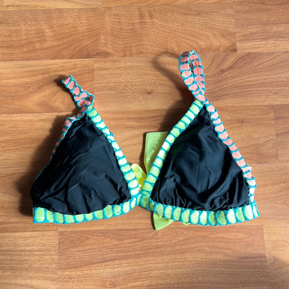 Black bikini top with blue, pink, and lime green color accents.